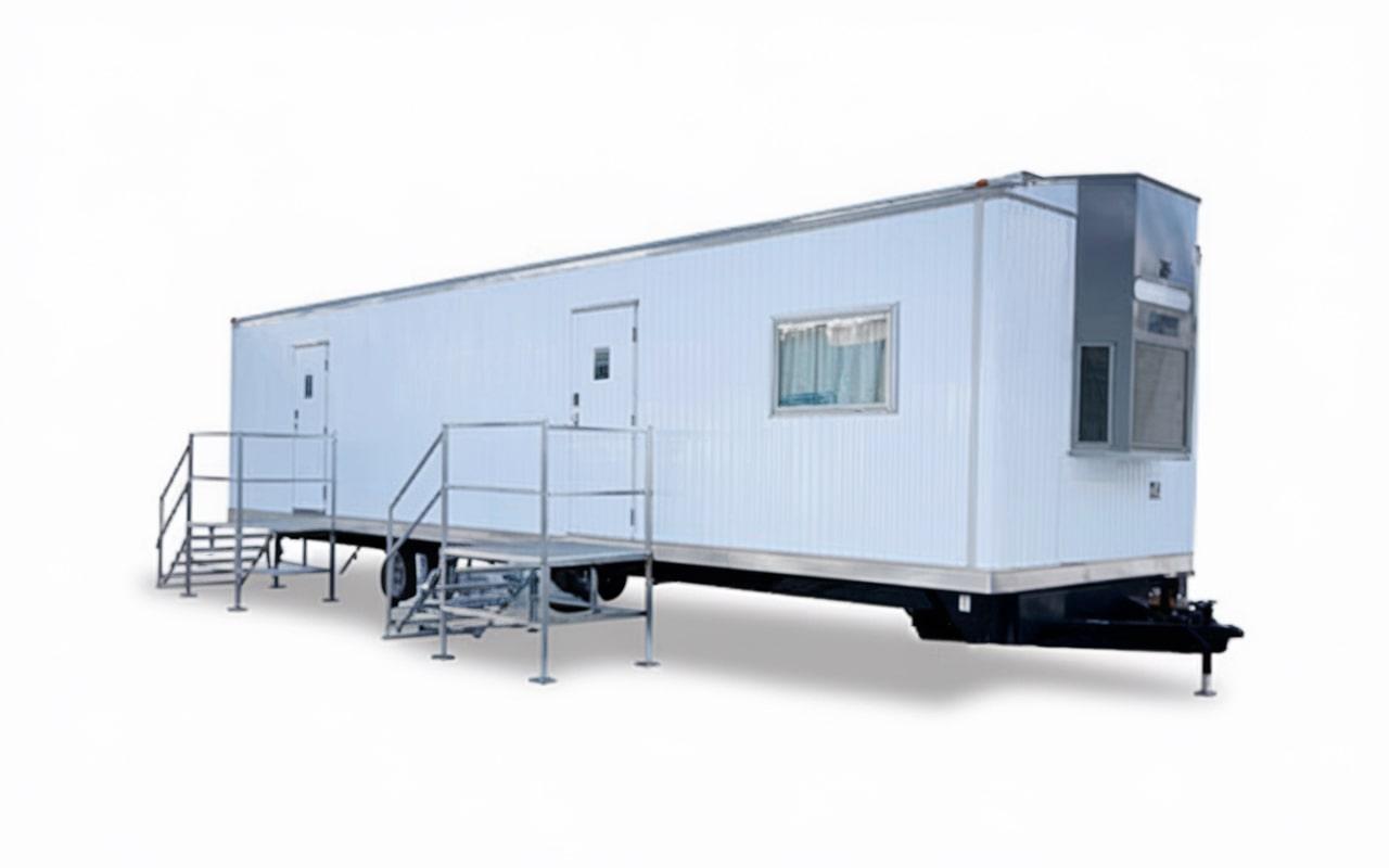 office trailers are typically delivered to the site using specialized transport trailers